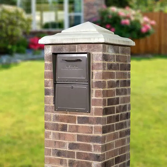 brick-bg-cropped Rich bronze locking mailbox installed in brick