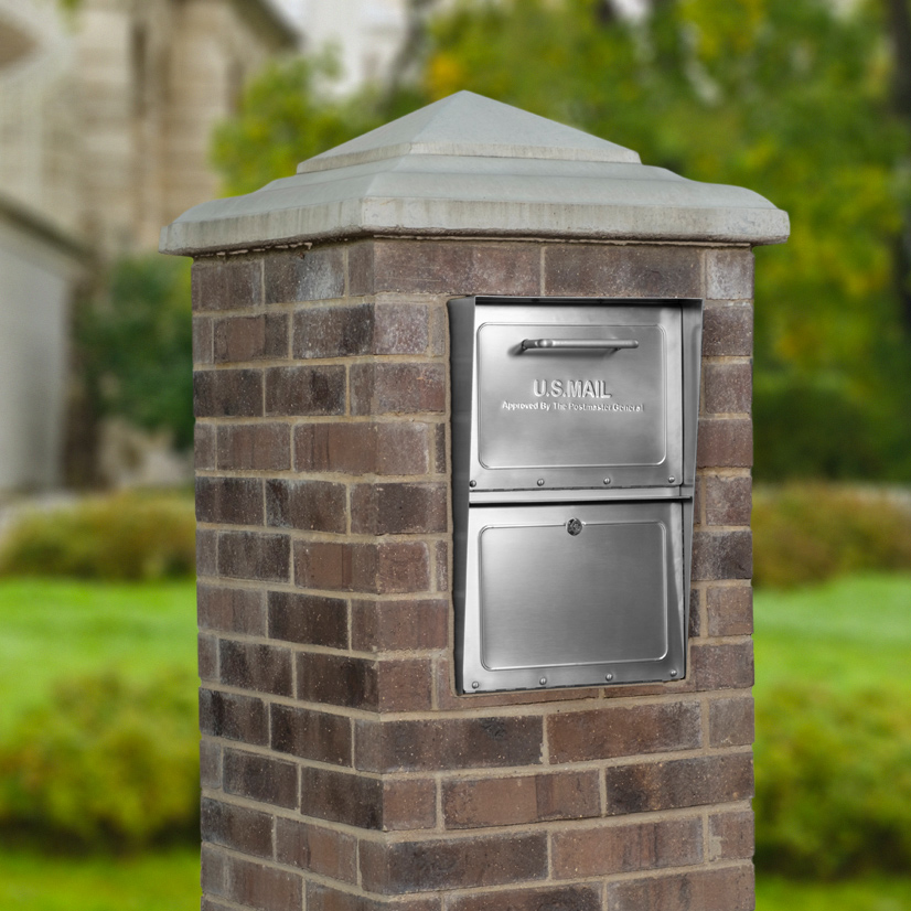 Stainless steel locking mailbox installed in brick