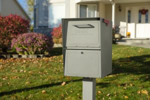 Storm Gray locking mailbox installed with post