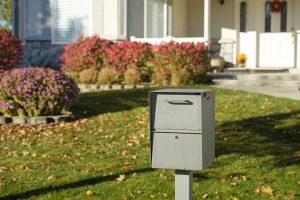 Storm Gray locking mailbox installed with post